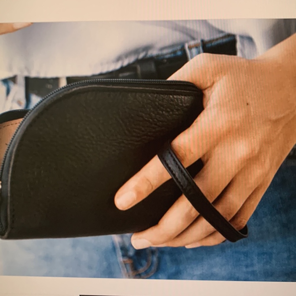 NWOT black leather wristlet holds phone lipstick and credit cards and a car key